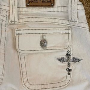 Sang Real white denim boot leg jeans.
